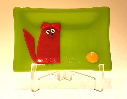Red Dog with Yellow Ball on Spring Green Background.